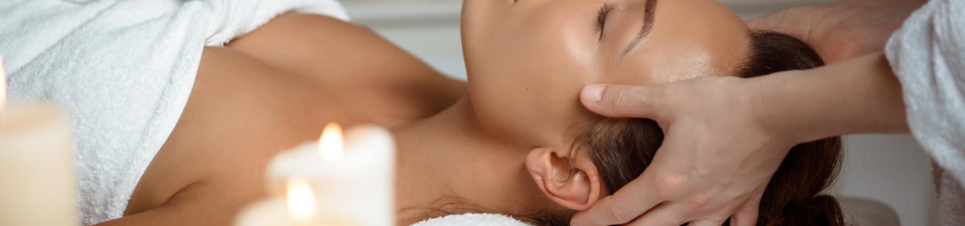 young-woman-having-face-massage-relaxing-spa-salon