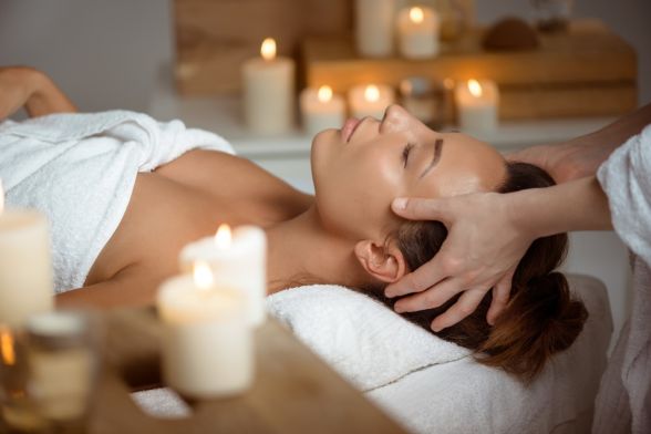 young-woman-having-face-massage-relaxing-spa-salon